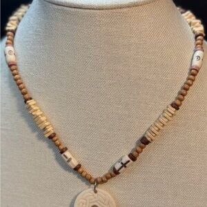 Carved Bone Disc Pendant Necklace with Wood & Bone Beads